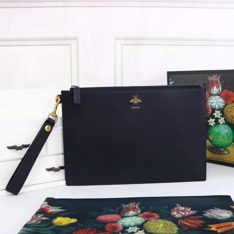 G*u*i clutch bags